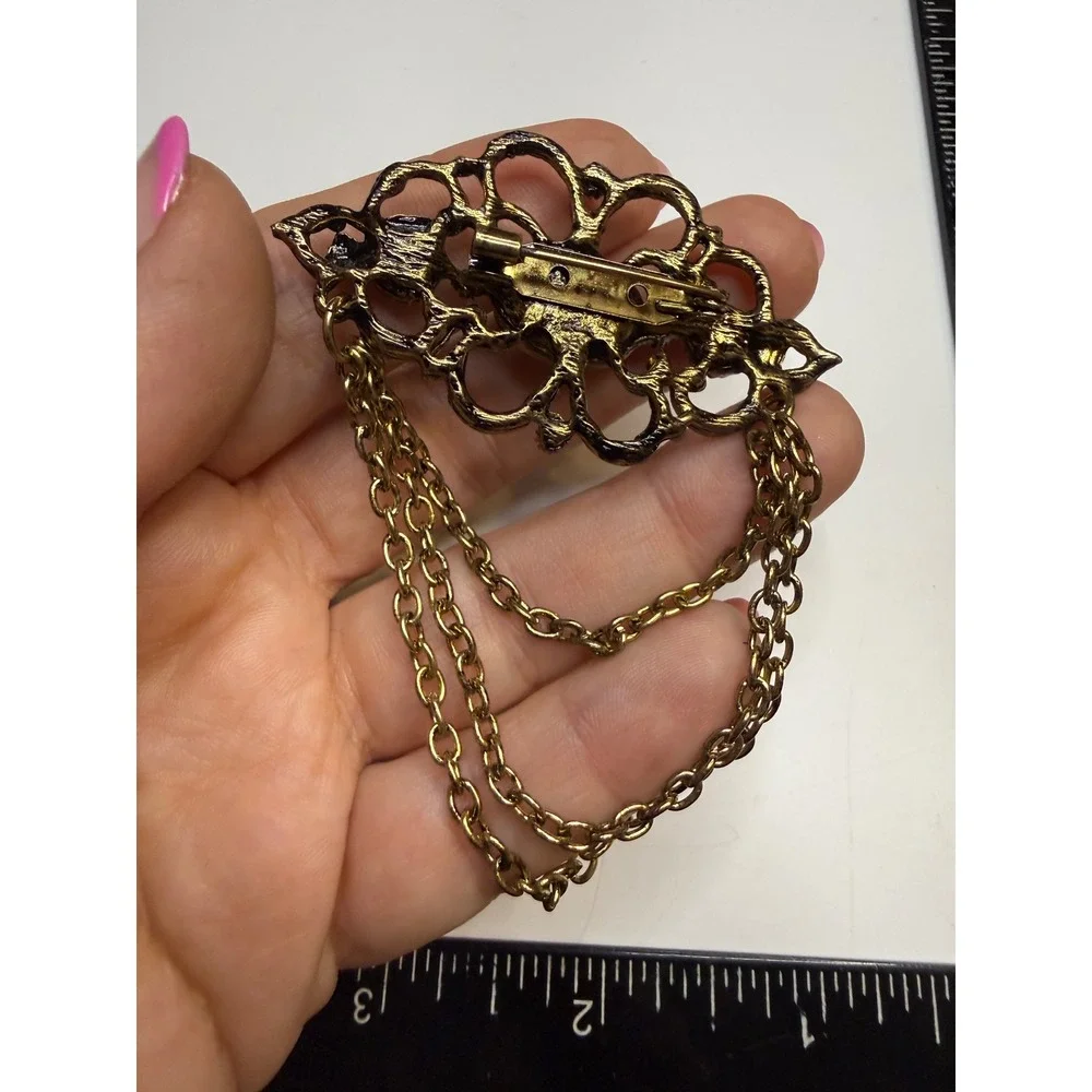 Ornate Gold Tone Filigree Brooch Faux Pearls Clear Cabochon and Triple Chain
